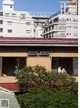 A couple of people sitting on top of a building.